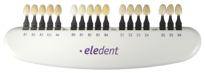Plastic holder containing shade tabs of Eledent brand acrylic teeth