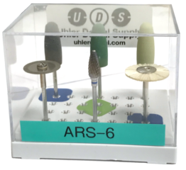 Small kit containing three acrylic polishers, diamond disc, carbide lab cutter, and bristle brush in small plastic container